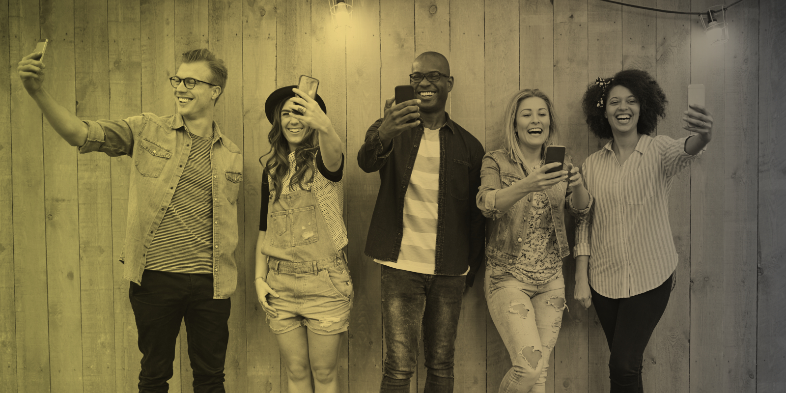 Marketers take photos against a woodgrain wall