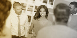 Five young professionals gathered for a sales meeting