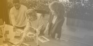 Three marketing professionals reviewing color swatches