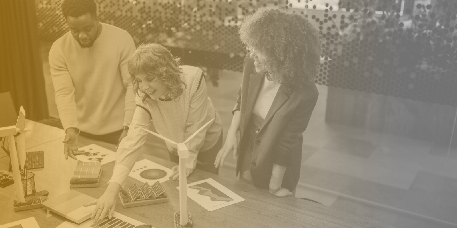 Three marketing professionals reviewing color swatches