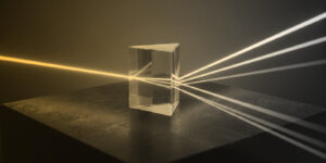 A beam of light passing through a prism, splitting into many beams